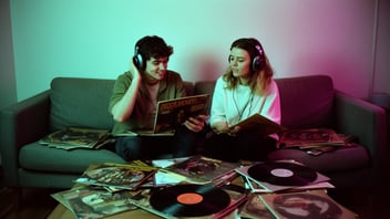Two People Listening To Vinyl Records